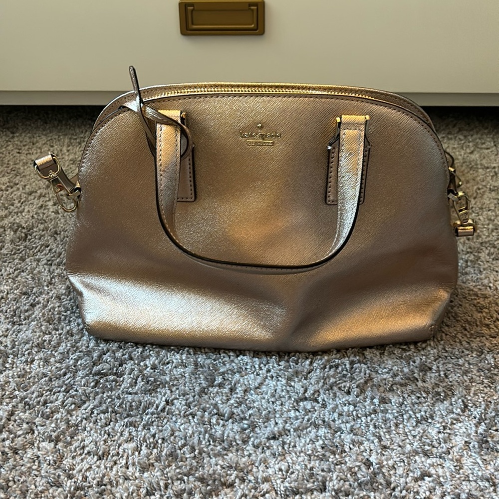 Rose gold pink Kate spade. Only used a handful of times